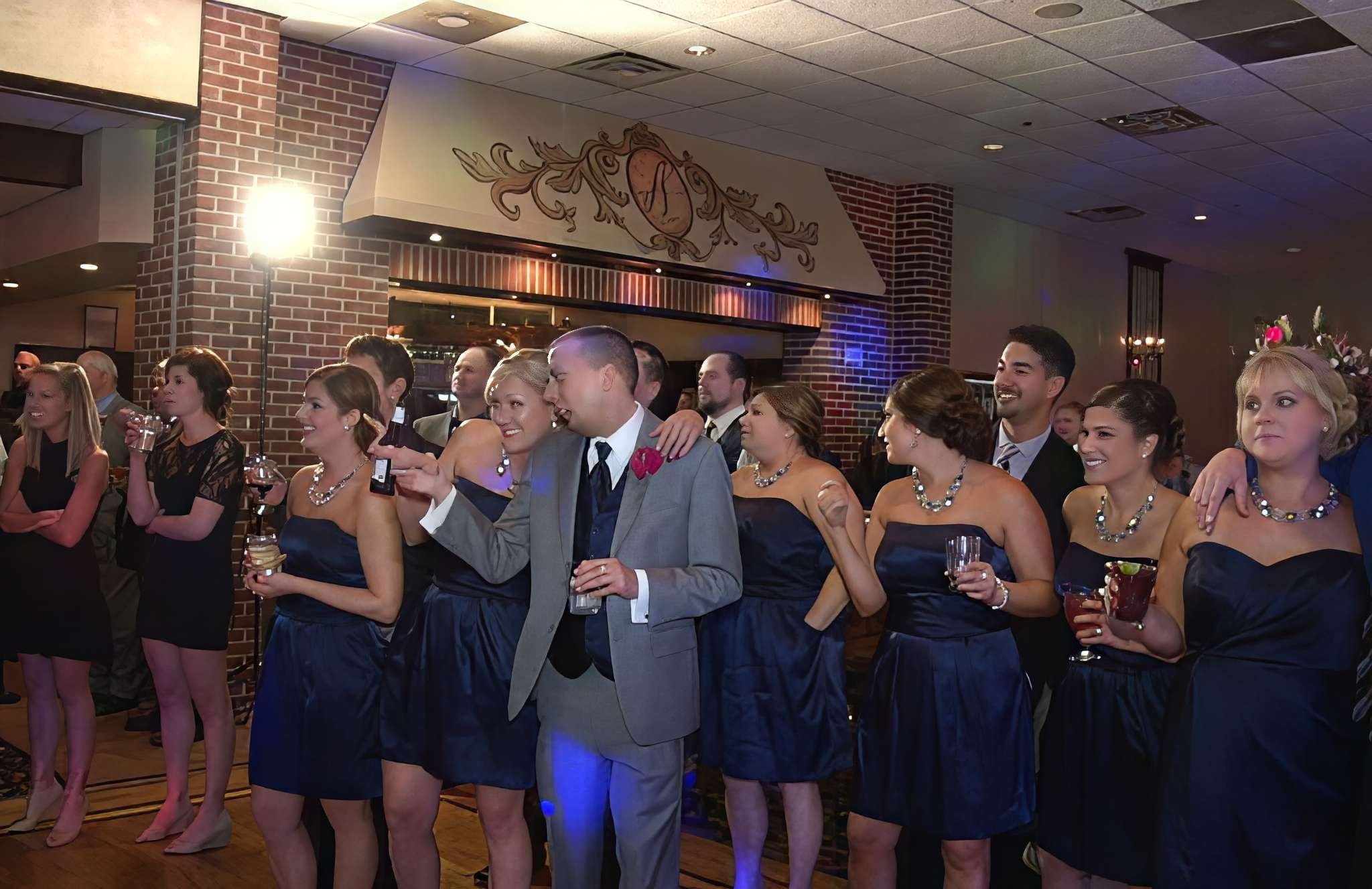 Excited guests watch Michael Jackson impersonator MJ3 arrive for a wedding reception performance