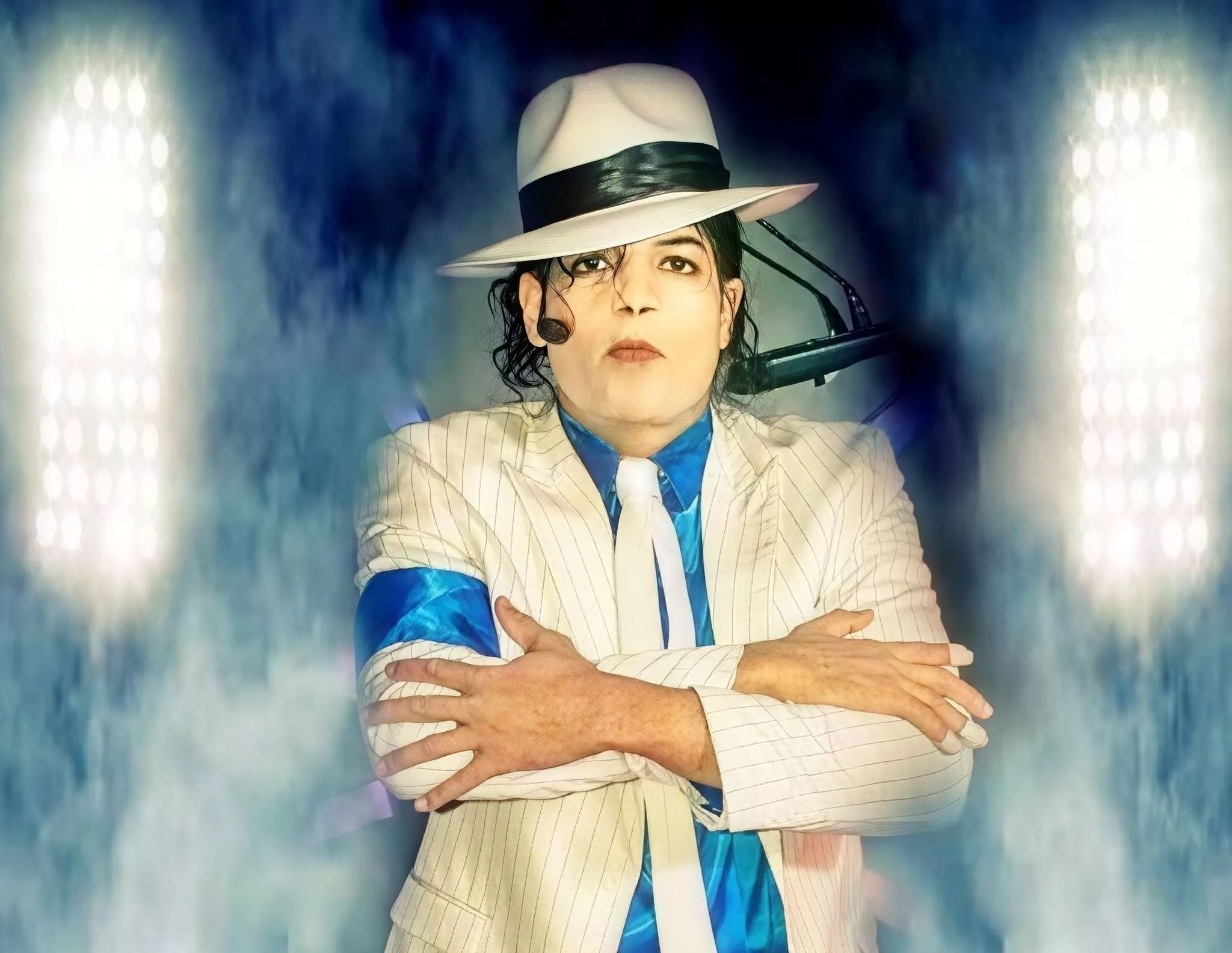 Michael Jackson impersonator MJ3 performs in Los Angeles with a white pinstriped Smooth Criminal outfit and matching fedora